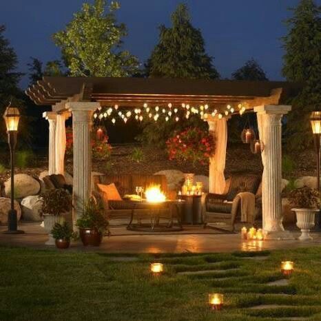 Great Pergola! Love the fire pit! And the Grecian pillars combined with the rustic wood is