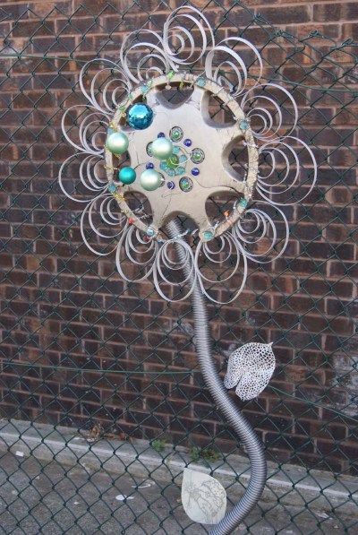 hubcap flowers!!  this woul