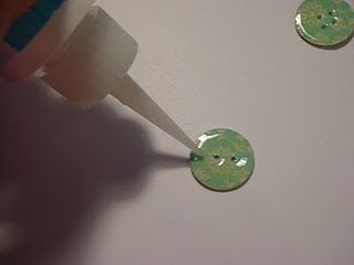 Make your own paper buttons. AWESOME!!!  Especially when I need the perfect color to go with a