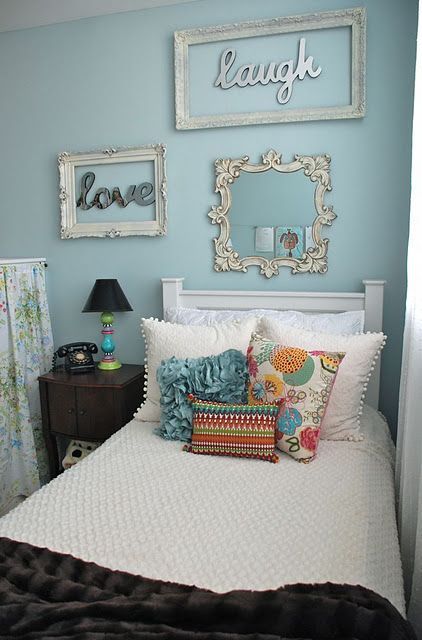 picture frames around words on the wall. pretty cute. love the bedding and pillows,