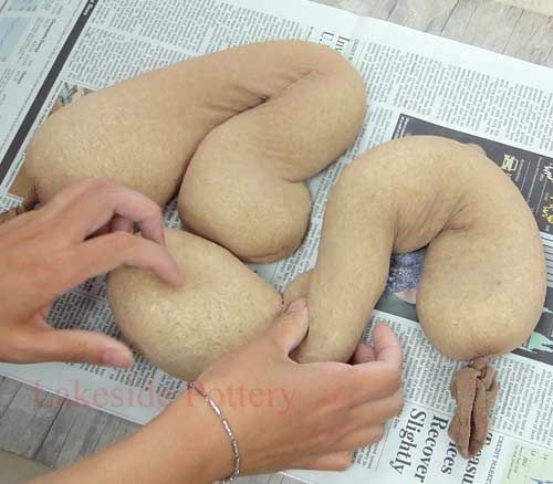 Rice in stockings: Great way to make soft molds for throwing your clay slab to form –