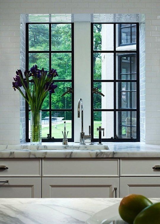 A Kitchen Look We Love: Black + Marble In this kitchen from Traditional Home (via Savor Home), marble gets punched up with just a bit of black, in the window frame. Bonus points for the way the subway