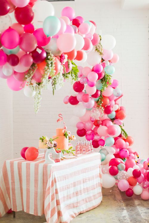Afraid your decor wont pop? Here is a balloon arch tutorial that will be sure to be a hit at your summer