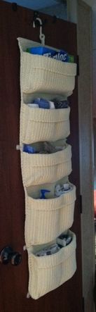 attach a hanging pocket storage from Ikea on the outside of the bathroom door for hand towels, washcloths, plastic bags,