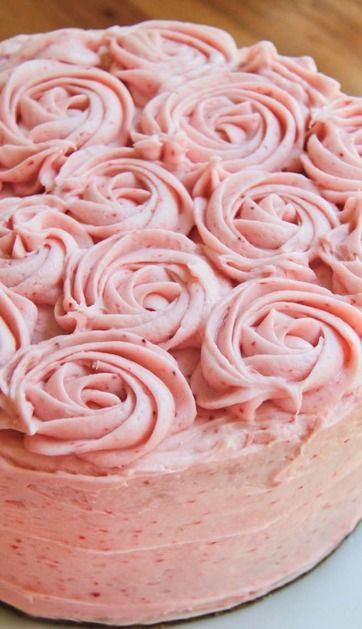 Fresh strawberry cake with strawberry buttercream frosting. Made with fresh