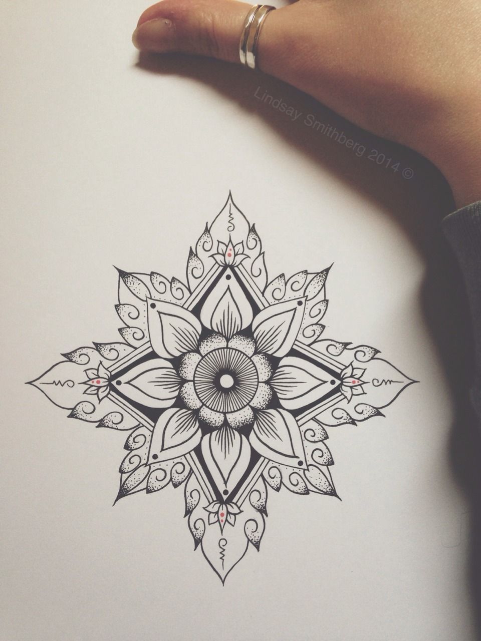 geometric flower art tattoo