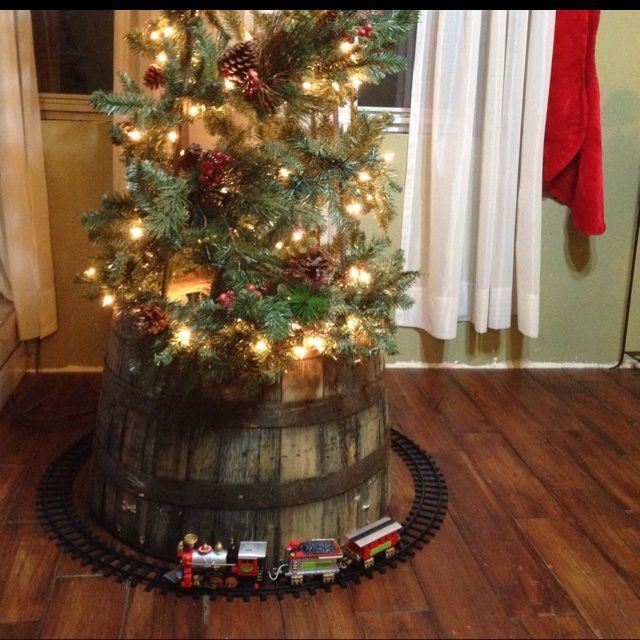 I love this idea of the barrel at the bottom of the tree! Child proofing and beautiful! Whiskey Country Christmas |