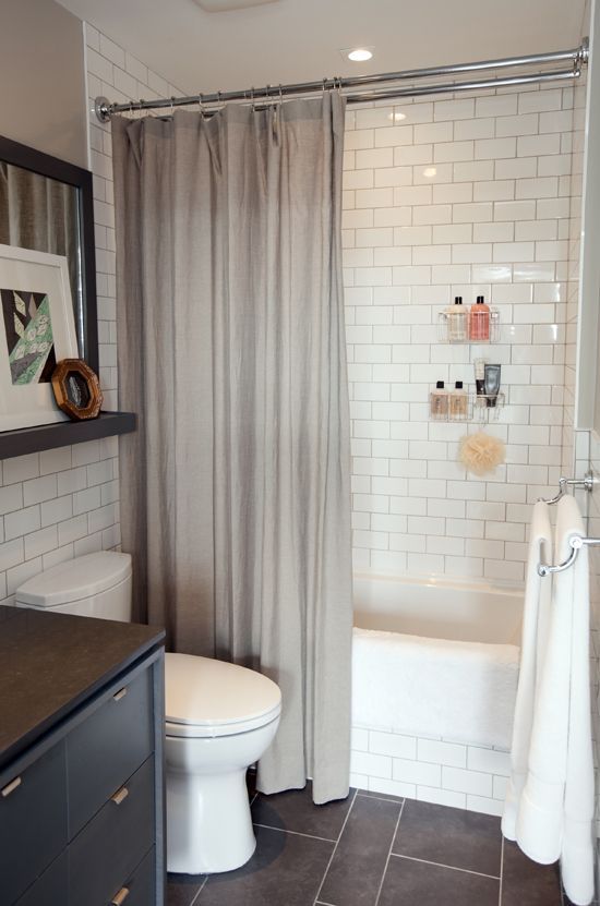 Lovely small bathroom – Dark tile floor, subway tile shower, love the shelf above