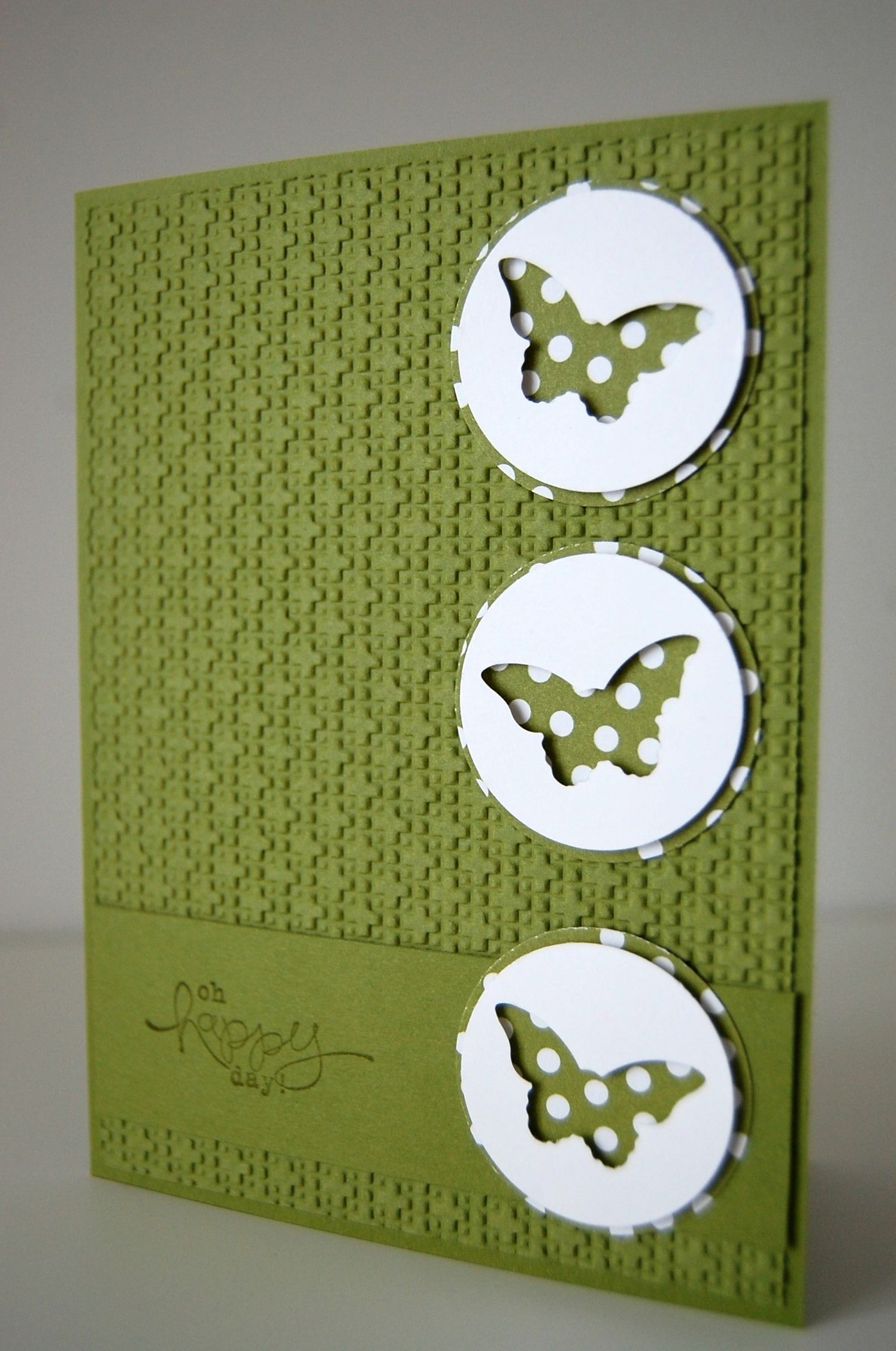 monochromatic butterfly card. Love the punches being used “in reverse” (keeping the outline instead of the punched shape)    from:
