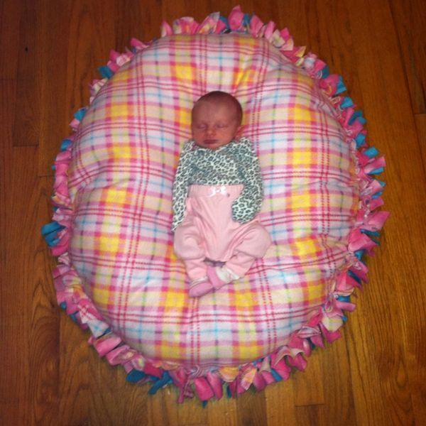 No-sew floor pillow pouf, made just like a tie fleece blanket but stuffed with poly-fil. Awesome baby