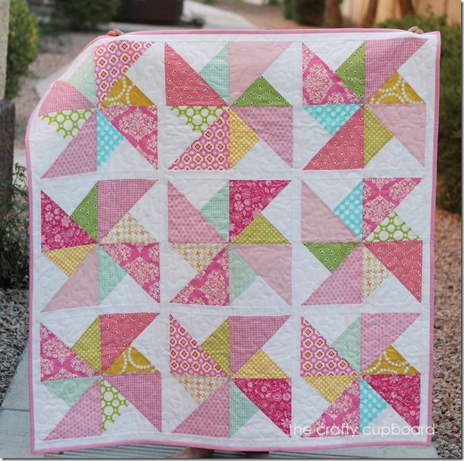 Pink Pinwheels by the Crafty Cupboard   Quilt measures 40.5 x 40.5 and uses various prints for the