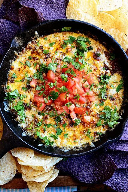 Queso Fundido. One of my very favorite party foods to feed a crowd. Serve with a bowl of chips and itll