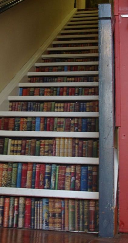Staircase book decor tis would b kinda cool to have a stair case but it would b a book case