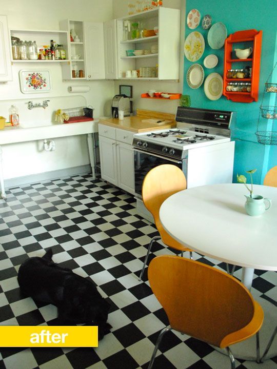 Another checkered floor, a cute plate holder turned spice rack and just to the right my favourite US kitchen accessory can be seen (a hanging fruit basket). The only thing Im not a fan of is the