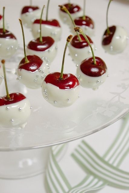 Cherries dipped in white chocolate and edible silver sugar pearls. How pretty would these be for a girls night party, or a shower or wedding. Such an easy elegant looking addition to a dessert
