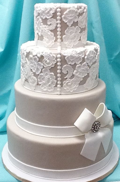 Lace Vintage Wedding Cake with buttons & bows–by Tracy Jordan at Simply Southern