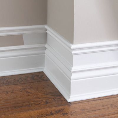 Make your baseboard more dramatic…add small pieces of trim to the top of existing baseboard, add a few inches and add another piece of moulding. Paint the wall and trim white. Cheap