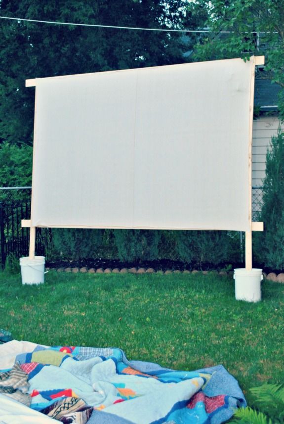 Make your own movie screen for outdoor movie nights….Simple and inexpensive! I may need to adapt this by adding “feet” to help it stand up if