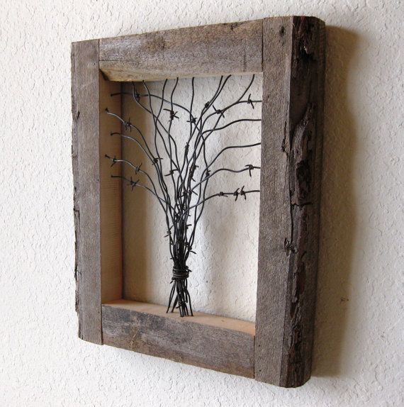 Reclaimed Barn Wood and Barbed Wire Tree Wall Art. This is about the ONLY thing barbed wire is good for. I could totally do this too.. we have the wood and way too much crap barbed wire that I