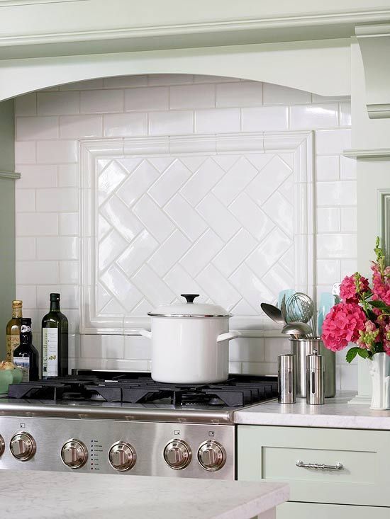 Subway tile is a classic choice for the backsplash; however, a herringbone pattern behind the range puts an unexpected twist on the