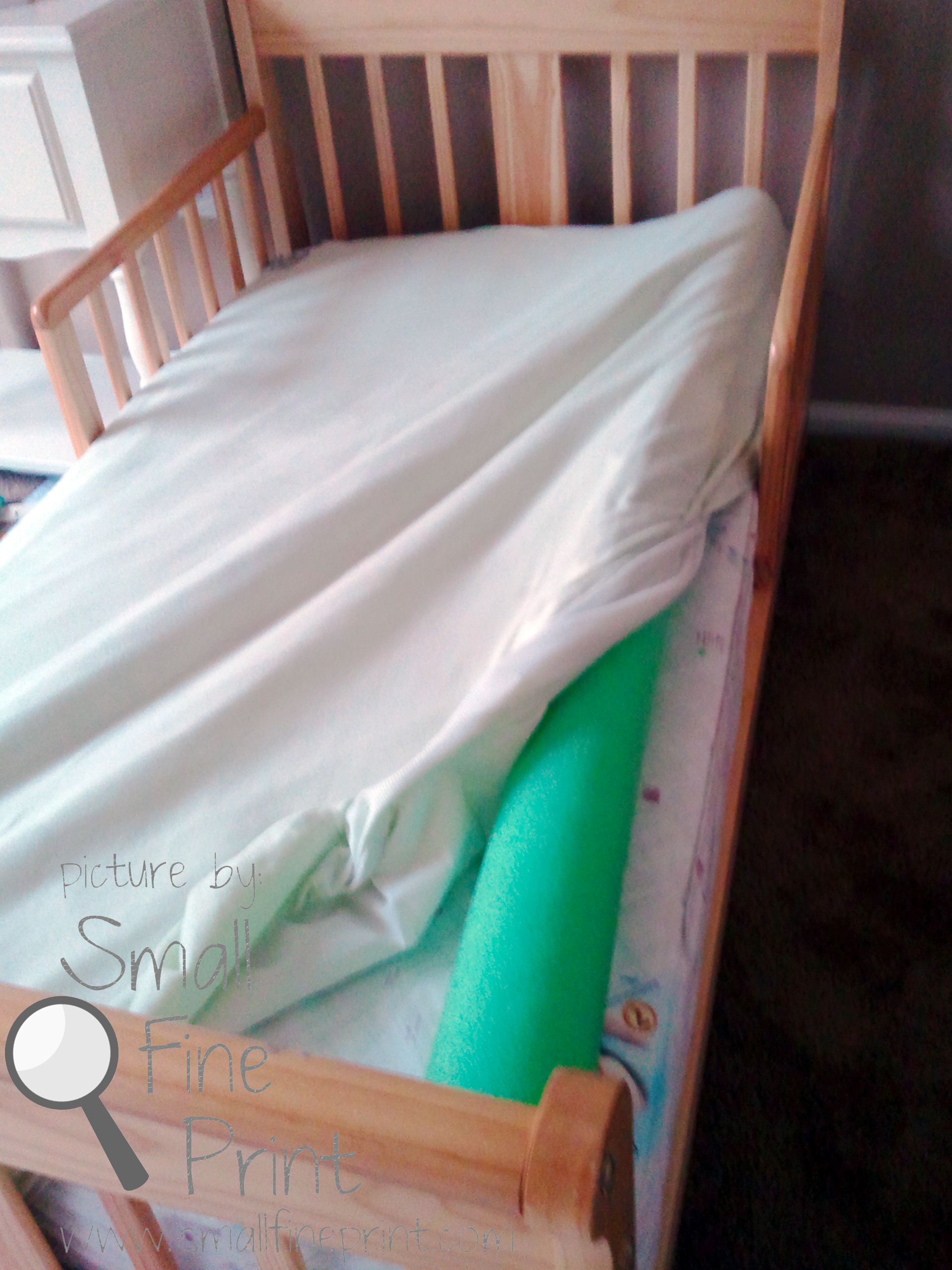 Use a pool noodle to keep your toddler from falling out of bed..what a great