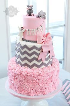 White, pink, and gray baby shower cake with chevron, flat rose, and pick bow with fondant