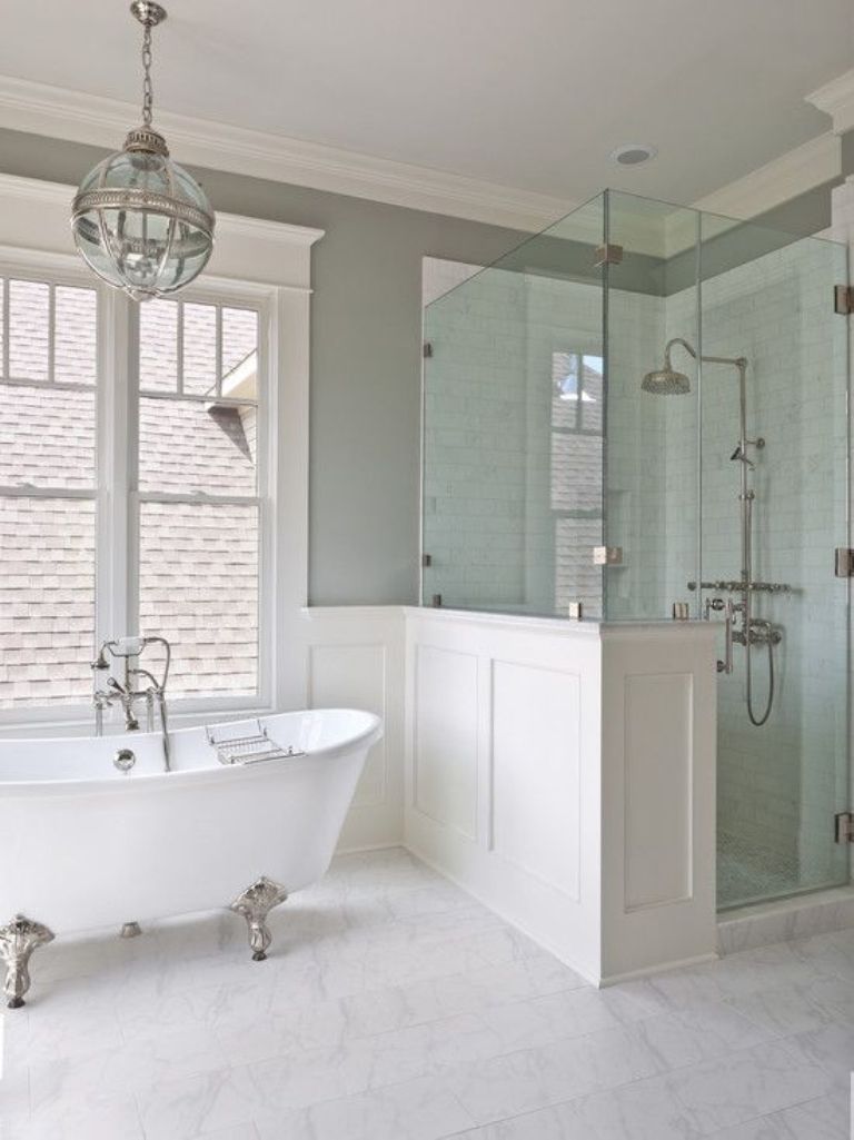 Airy bathroom with white silver clawfoot bath tub