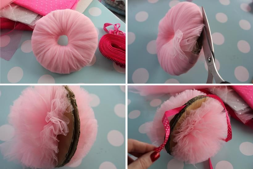 DIY pink tulle pompom decorations. Really lovely. You could make these, in white, on the large pompom maker, and they would look