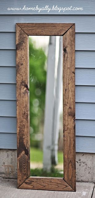 DIY rustic mirror instructions from the blog homebyally.  All she used was a mirror from Walmart, a staple gun, gorrilla glue and
