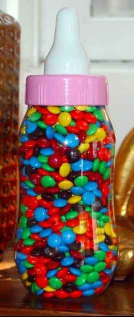 Fill the bottle with treats. Have guests guess how many there are. Who ever is the closest takes the treat home.