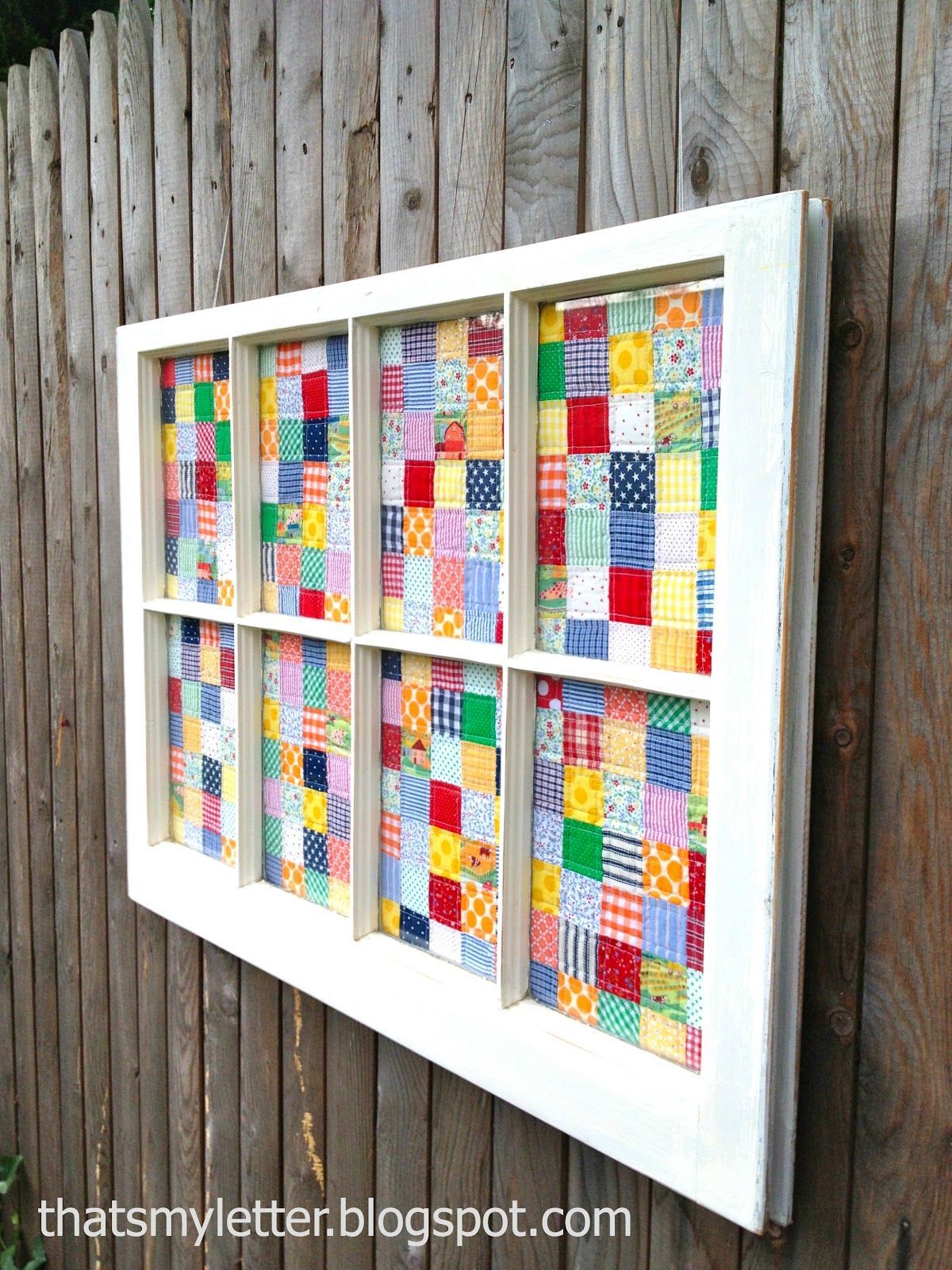 Frame a quilt! I love the idea of using an old window!   loooooove this!!