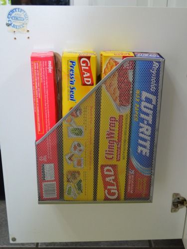 Get plastic wrap and aluminum foil out of the way by stowing them in a well-hidden magazine file.