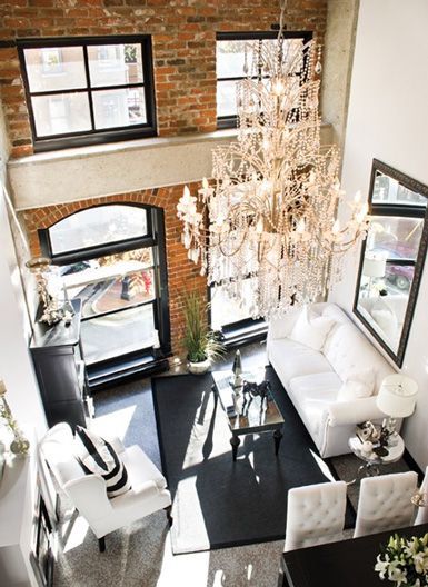 giant chandelier and exposed brick wall beautiful