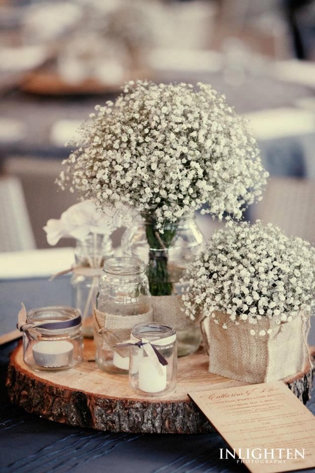 gypsophila table centrepieces with tree trunk plate – gives a taste of the Italian outdoors!