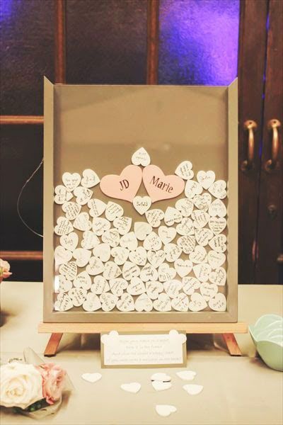 Have each guest sign a small wooden heart and drop it in a shadow box frame. This creative guest book becomes a fun piece of art