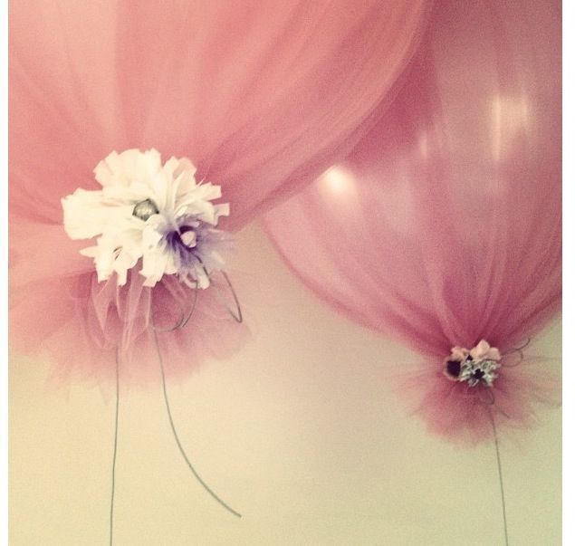 Inflate balloons, cover with tulle, tie at bottom with flowers. Easy and beautiful!