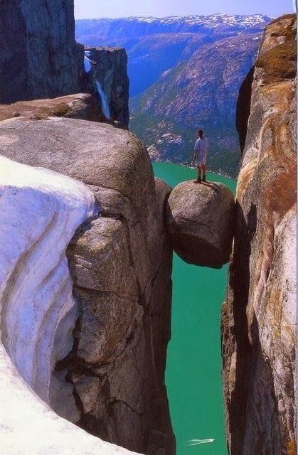 Kjeragbolten, Norway. Standing on this rock must be incredible! Would you dare??
