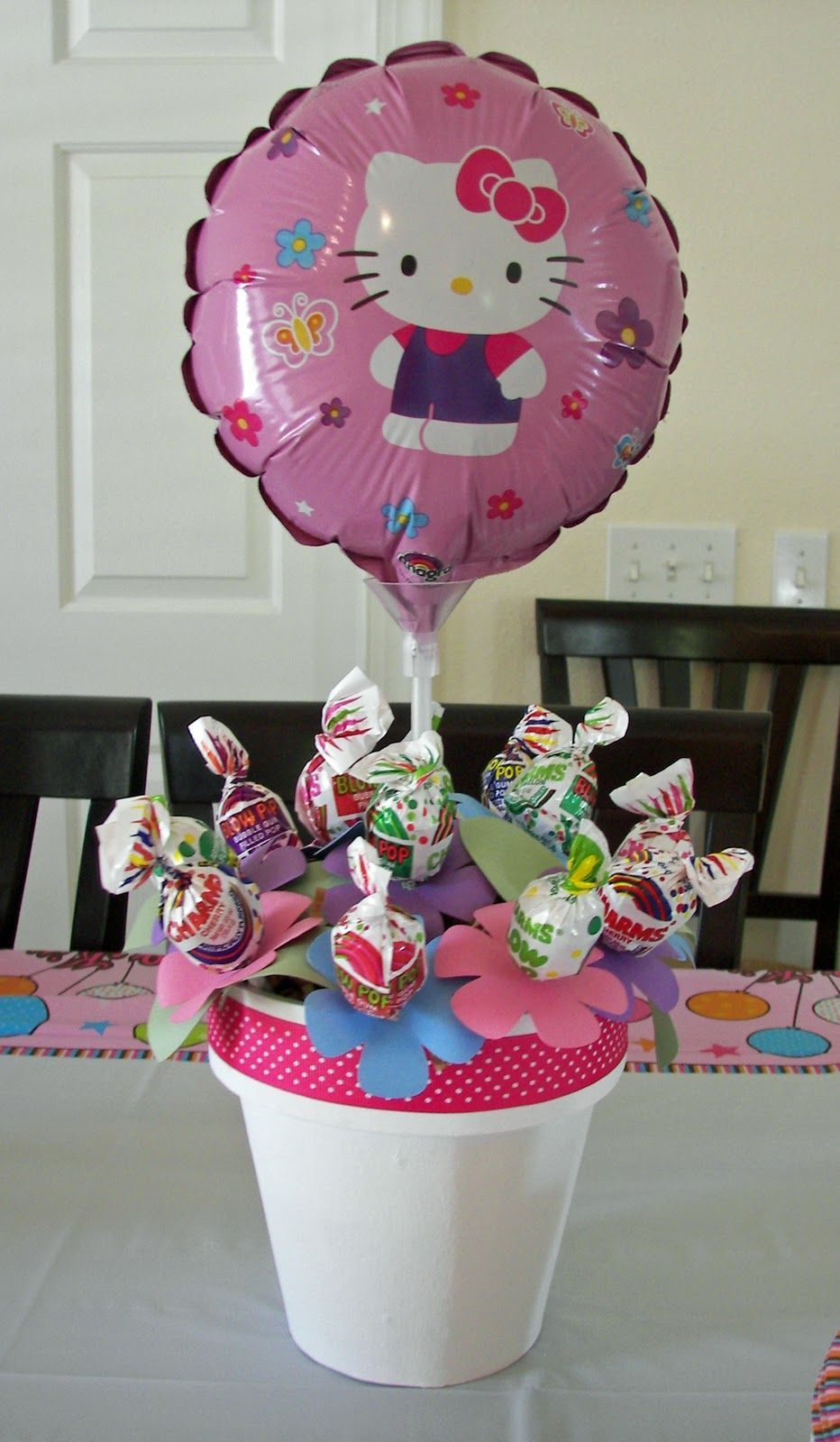 Lollipop centerpiece — Cute idea and you can do with whatever the theme is.