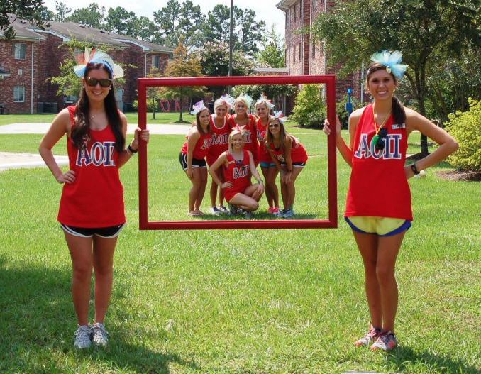 Love this! New member Ed and VPM holding the frame with the new pledge class inside! Soo cute!