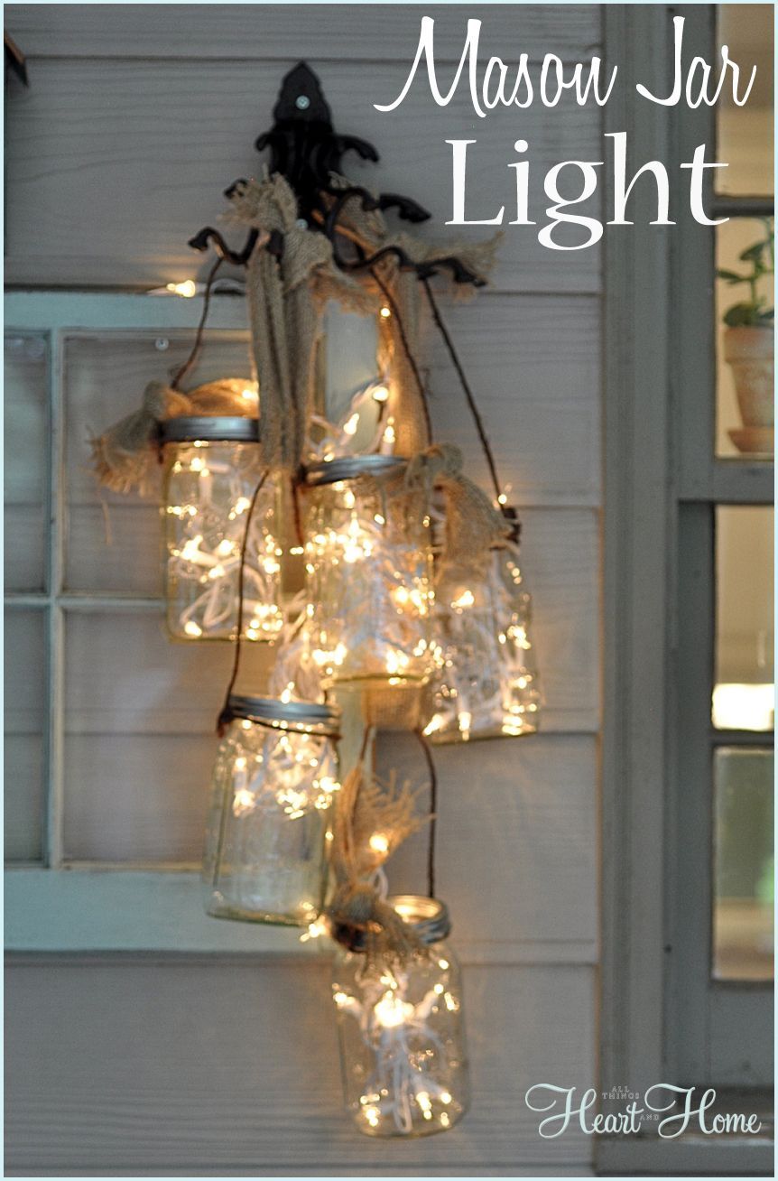 Make a Mason Jar Light using white twinkle lights, burlap, rustic hooks and of course mason jars! Its quick and easy and adds