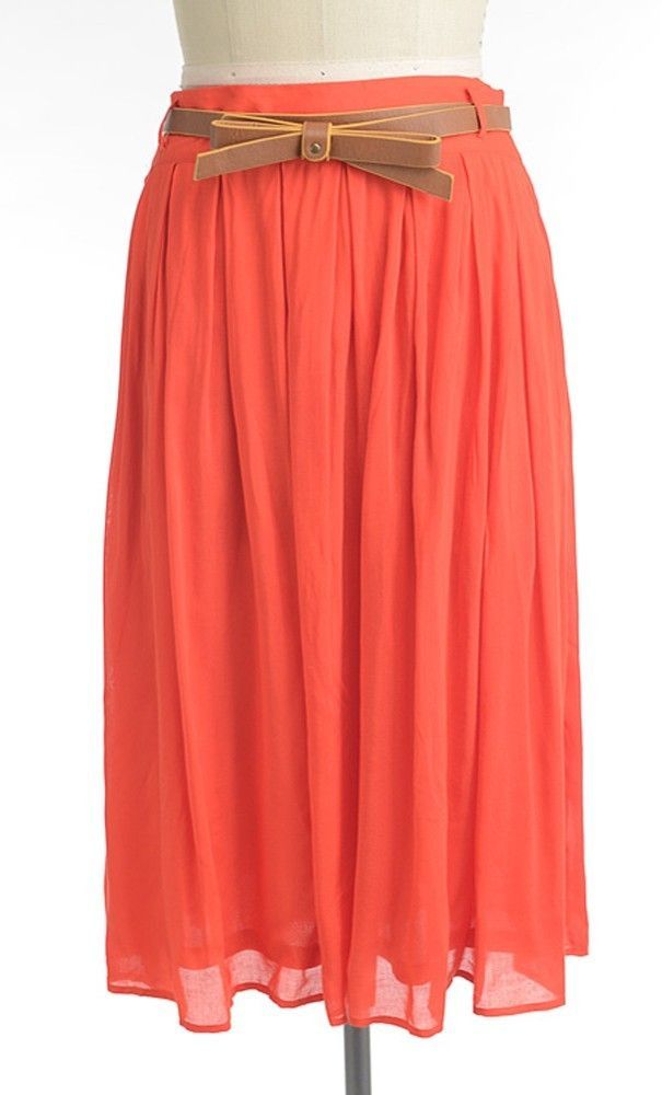 Modest knee length a-line skirt with vintage pleated look and added belt available in coral S-L.