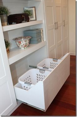 Para la lavandera Add a drawer in a custom closet (this one is an IKEA Pax Wardrobe hack) for storing laundry baskets.  LOVE!