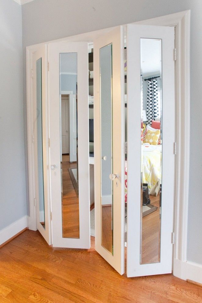 Pretty closet doors with mirrors and glass doorknobs.. make the bedroom look larger!