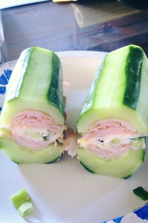 Sandwich with cucumber instead of bread.  Thats a LOT of cucumber, but it might be worth a try.
