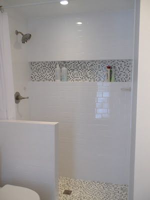 shower shelf…best idea ever.  Helen note:  interesting shower design with inlaid shelf detail echoing the floor.  low wall on