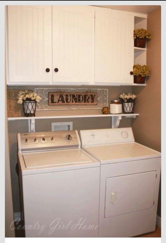 Small laundry room idea in taupe and white with a shelf over the washer and dryer.
