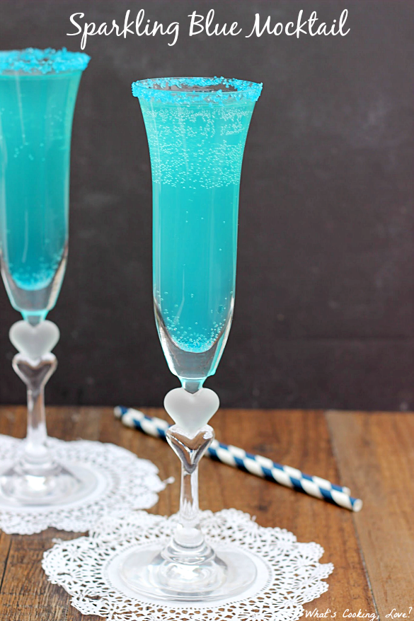 Sparkling Blue Mocktail. Delicious non-alcoholic drink that is made by combining blue fruit punch and sparkling white grape juice.