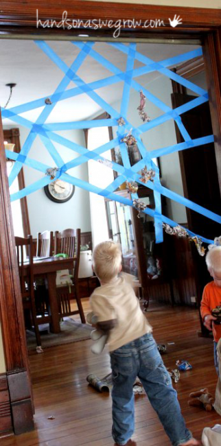 Sticky spider web! Good rainy day activity- make web out of painters tape, throw newspaper, cotton balls, or pom poms.