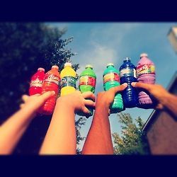 summer bucket list | fill the bottles with paint. Take a pin and poke a hole in the caps of the bottles. Get all your friends