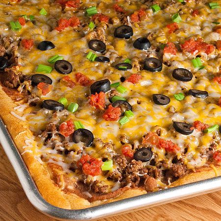 Taco Pizza   1 lb. ground beef  1 envelope taco seasoning mix  2 (8 oz.) cans Pillsbury crescent rolls  1 (16 oz.) can refried